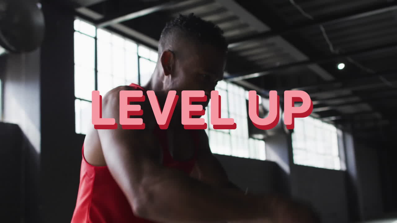 Level up text animation over person exercising in gym, lifting weights