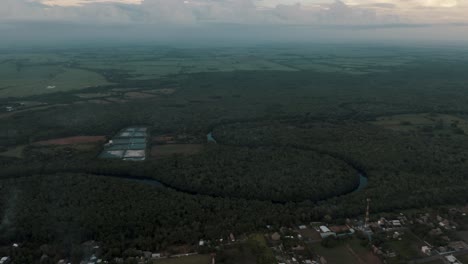 panoramic view of el paredon town, forest, river, nature preserve, and beach at sunrise in el paredon, guatemala
