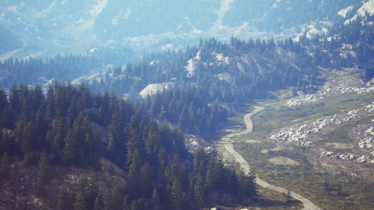 Majestic mountain landscape with winding path and evergreen trees at dawn