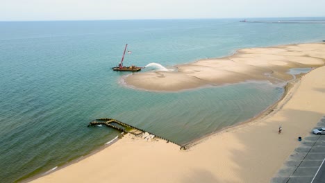 Dredging-the-beach-at-Pere-Marquette