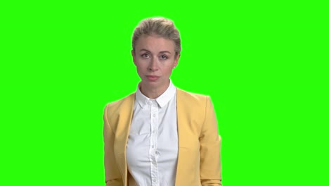young angry business woman on green screen.
