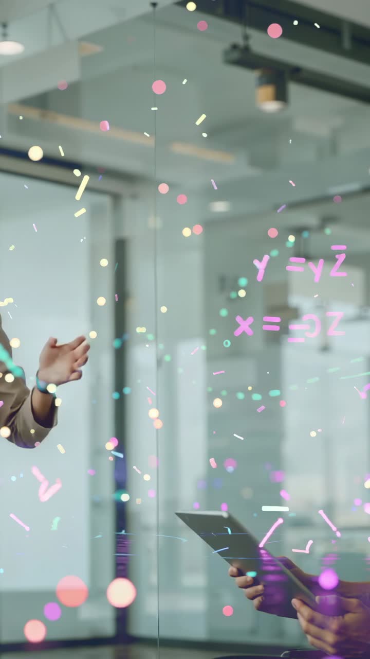 Vertical video: Gesturing presenter displaying formulas on conference wall with peer tapping tablet