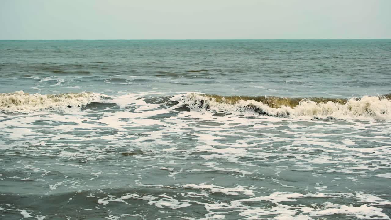 Waves of dirty polluted ocean water of Indian ocean, bay of Bengal in monsoon season