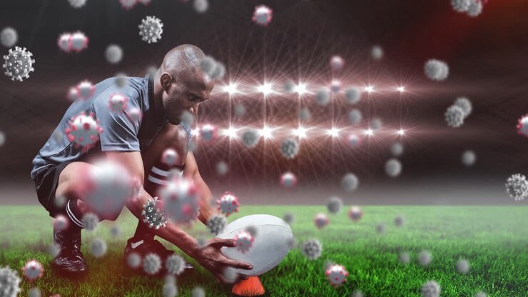 Animazione di cellule virali su un giocatore di rugby maschio birazziale allo stadio