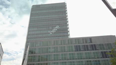 modern glass facade of a corporate office of regus - eindhoven, kennedy toren in netherlands