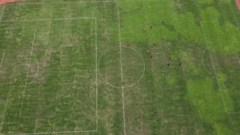 Aerial-view-of-people-playing-"tiki-taka-tactics"-in-football