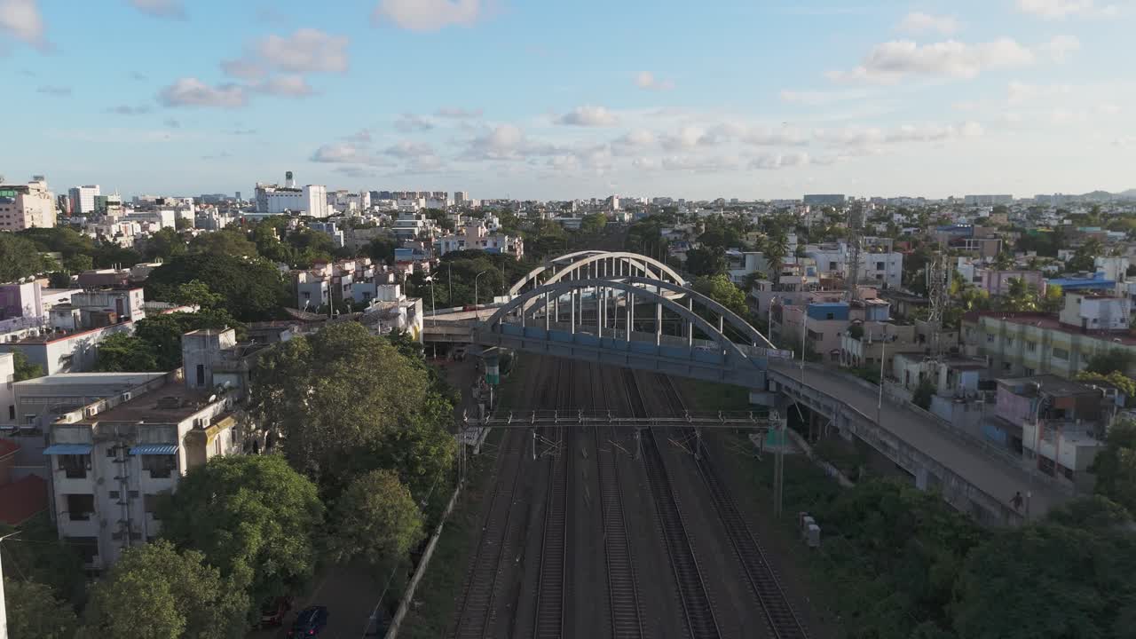 An cinematic aerial video of T. Nagar Railway Station and the surrounding flyover in Chennai in the morning would offer a unique perspective of the city's bustling transportation hub