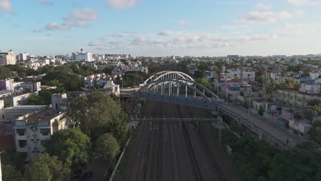 an cinematic aerial video of t. nagar railway station and the surrounding flyover in chennai in the morning would offer a unique perspective of the city's bustling transportation hub
