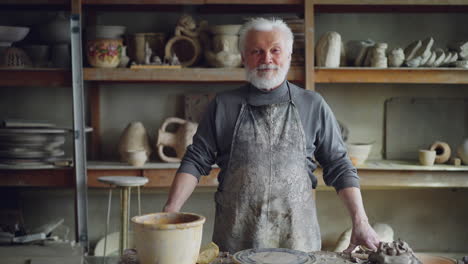 senior potter in workshop