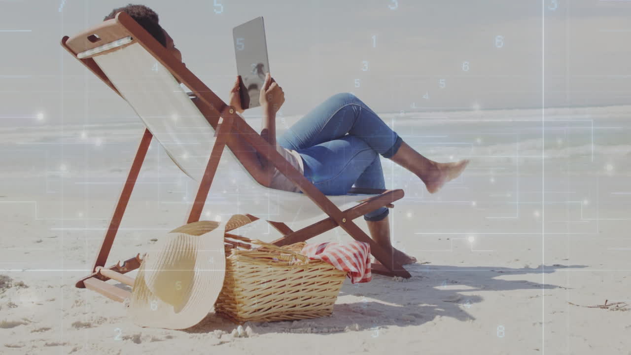 Adult woman reclining on beach chair, browsing tablet, showing digital grid overlays for technology