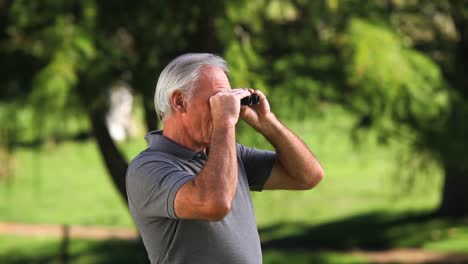 Old-man-looking-through-binoculars