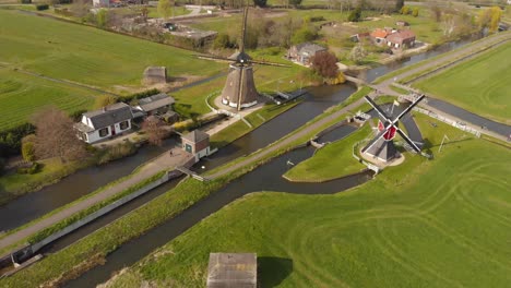 this landscape with windmills is just a short bike ride outside of the city of utrecht in the netherlands