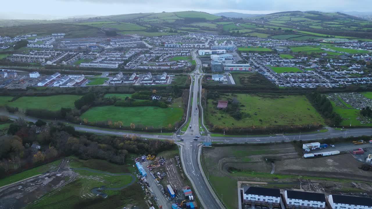 panoramic aerial view of Wicklow Town, County Wicklow, Ireland. Wicklow mountains in the background and a construction site next to a highway.
