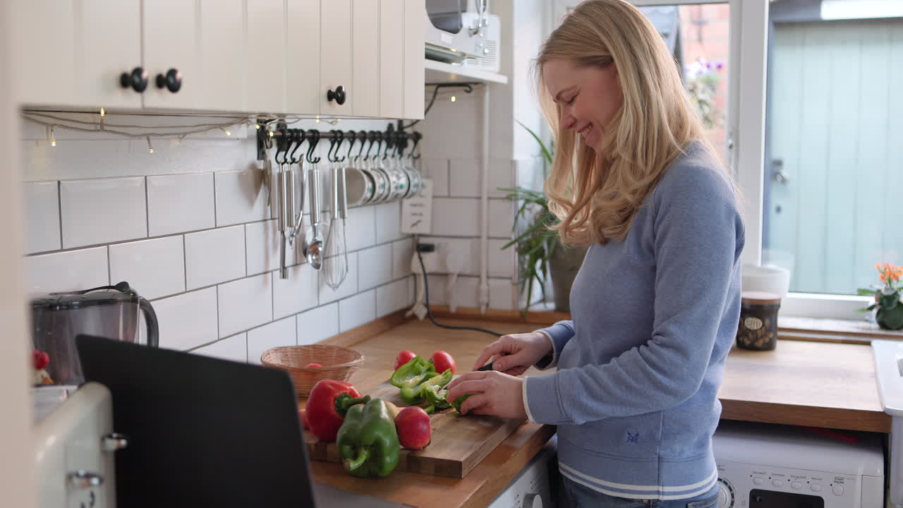 Woman cooking with vegetables in the kitchen