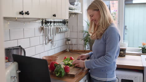 woman cooking with vegetables in the kitchen