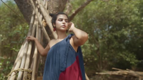 slow motion shot of beautiful model posing outdoors in blue and red garmant