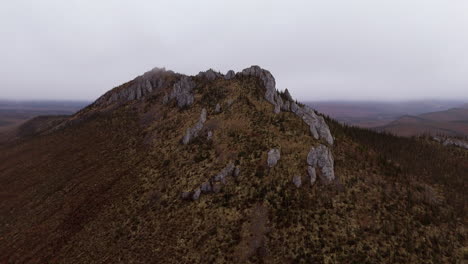 peak of ogilvie mountains during cloudy day at dempster highway in yukon territory, northwestern canada. aerial shot