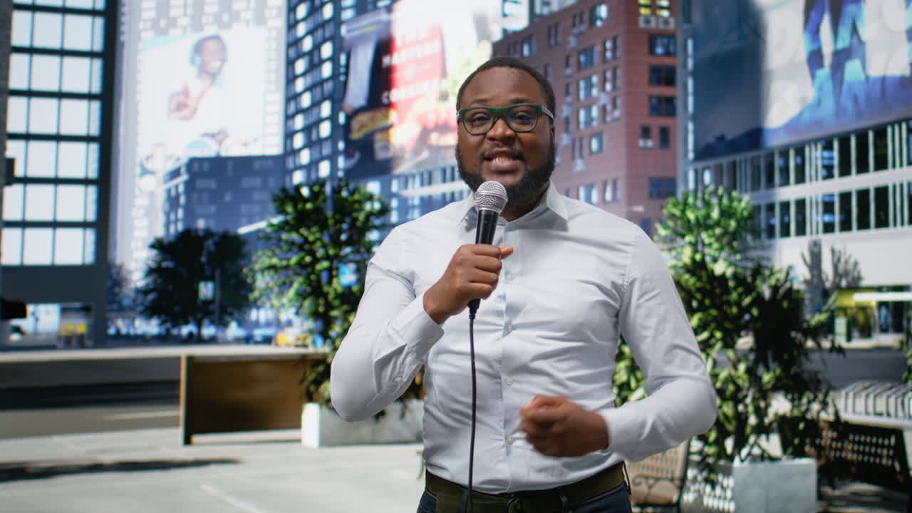 Black presenter in a modern city center speaking into a microphone