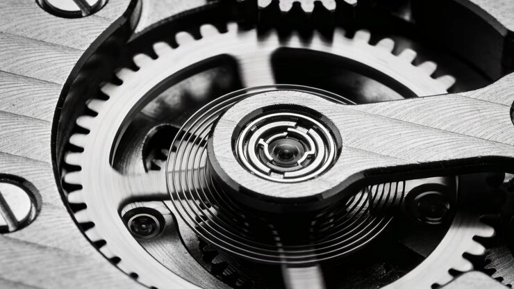 Oscillating center balance wheel rotating gear teeth, mainspring powering macro rig with hairspring