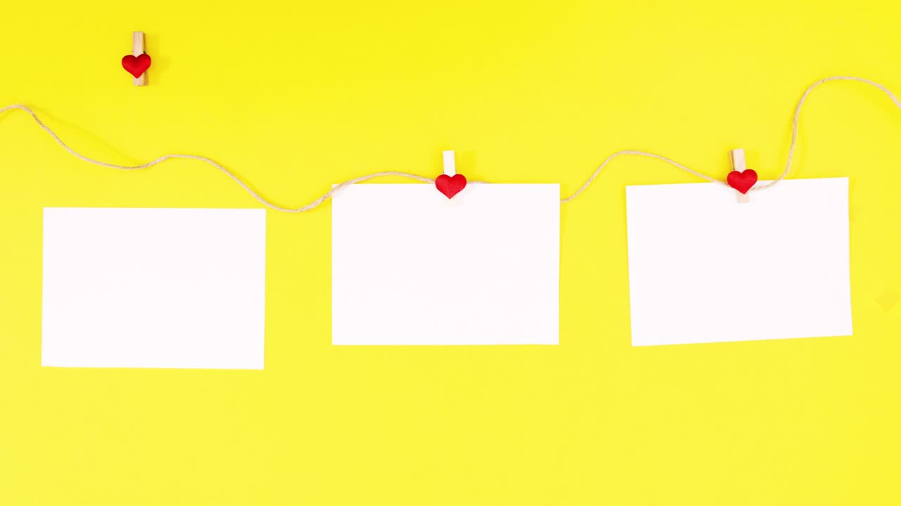 노란색 테마의 발렌타인 데이 텍스트를 위해 로프에 종이 hooping. 스 모션