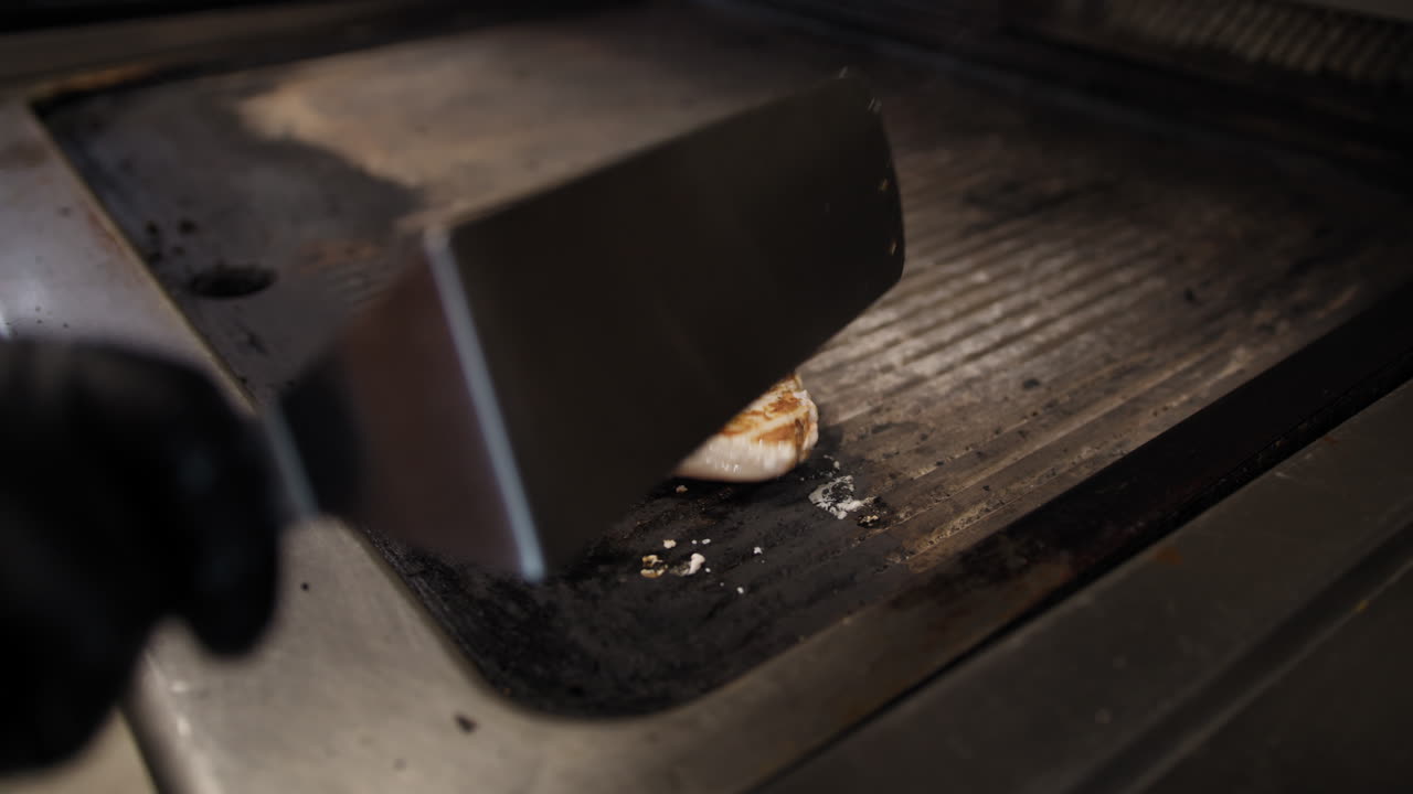 Chef Flipping The Swordfish Slice For Grilling