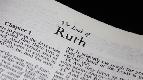 close up shot of bible turning to the book of ruth