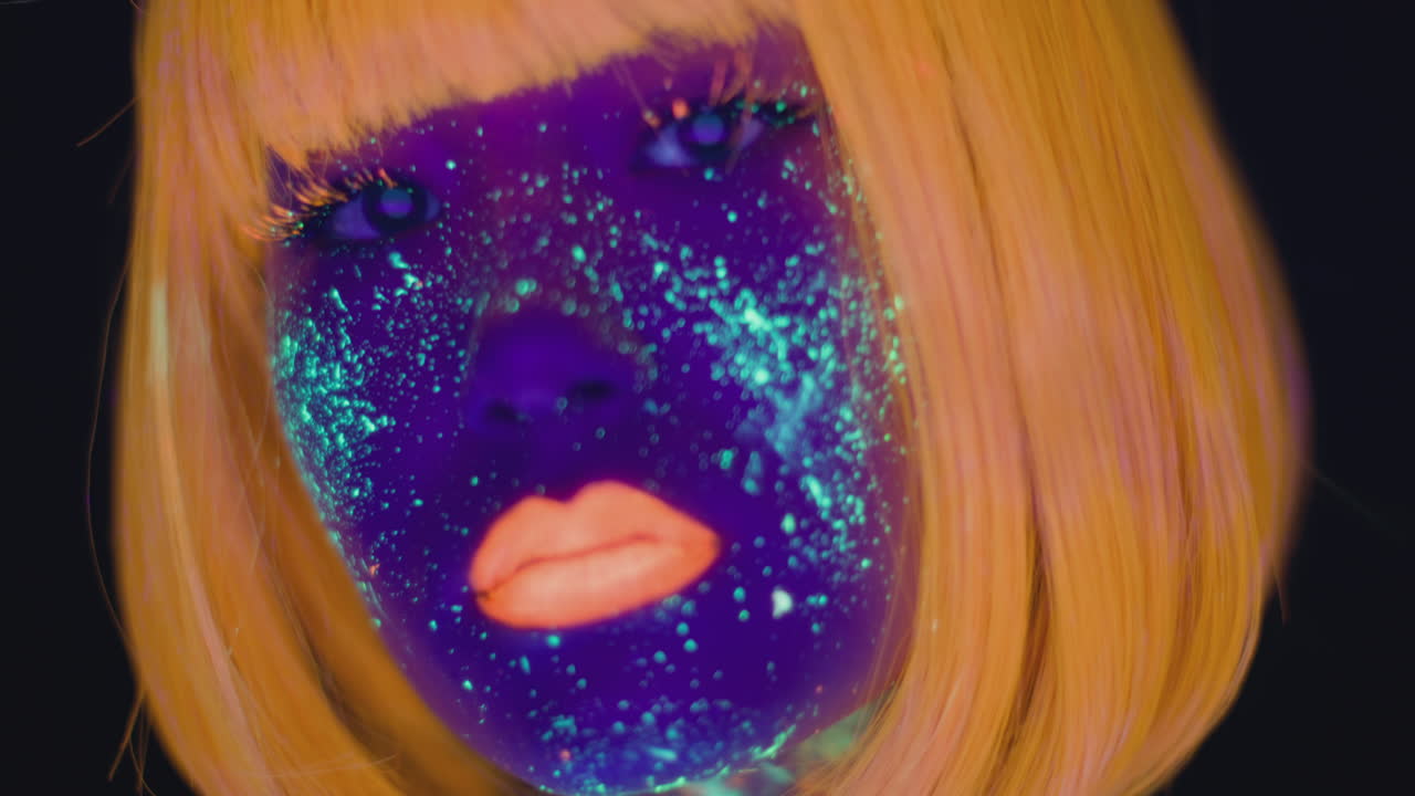 Glowing Woman with Neon Makeup and Orange Hair