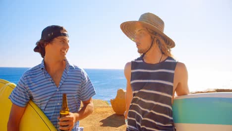 male friends interacting with each other in the beach 4k