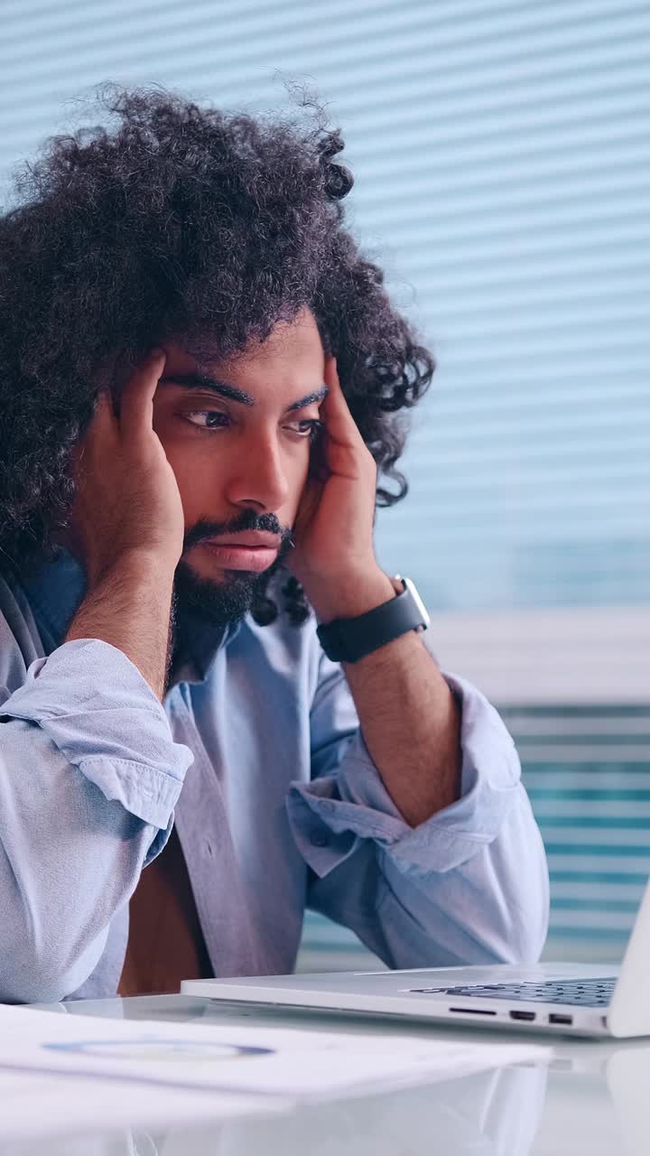 Frustration builds as the clock ticks during a work deadline in the office