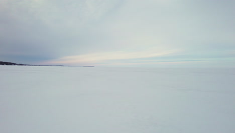 Flying-drone-above-a-frozen-lake-in-canada