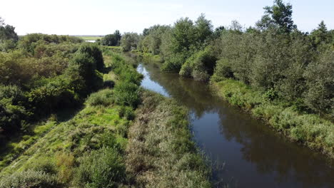 Aerial-Shot-Of-Nature-Valley-With-Blue-River-In-Germany,-Drone