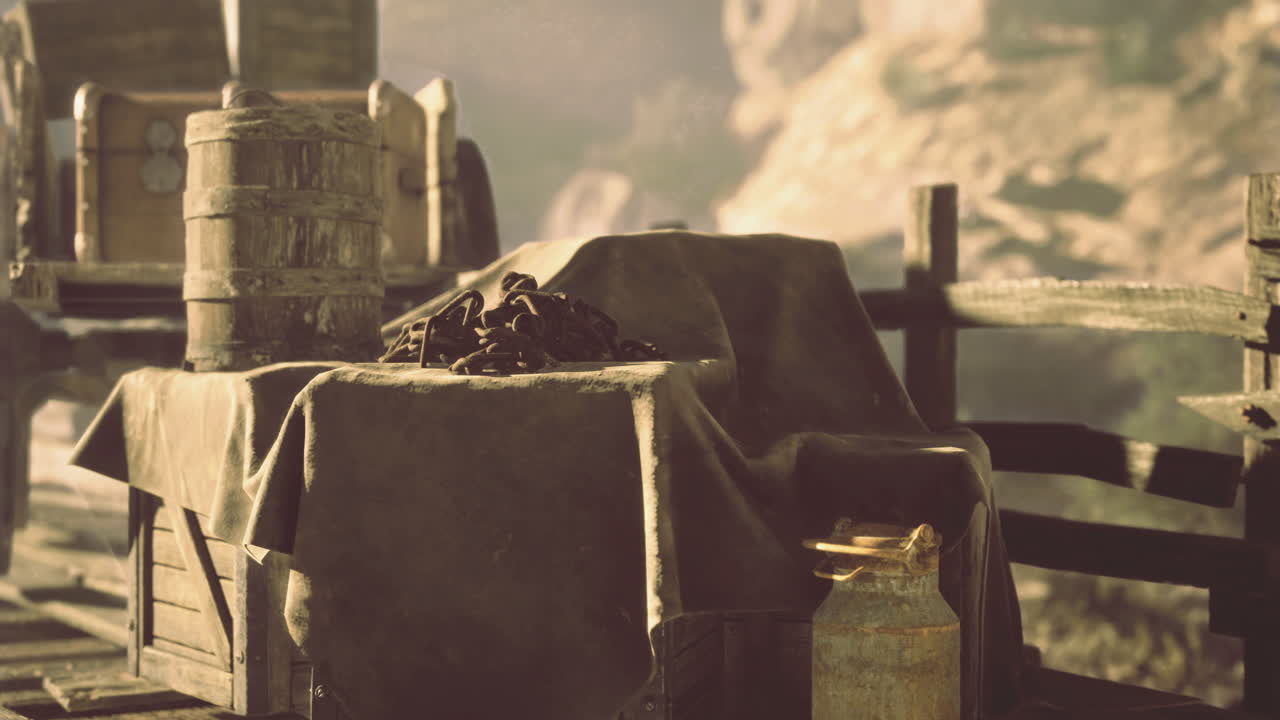 Old wooden cart with supplies by a rustic wooden fence under sunlight