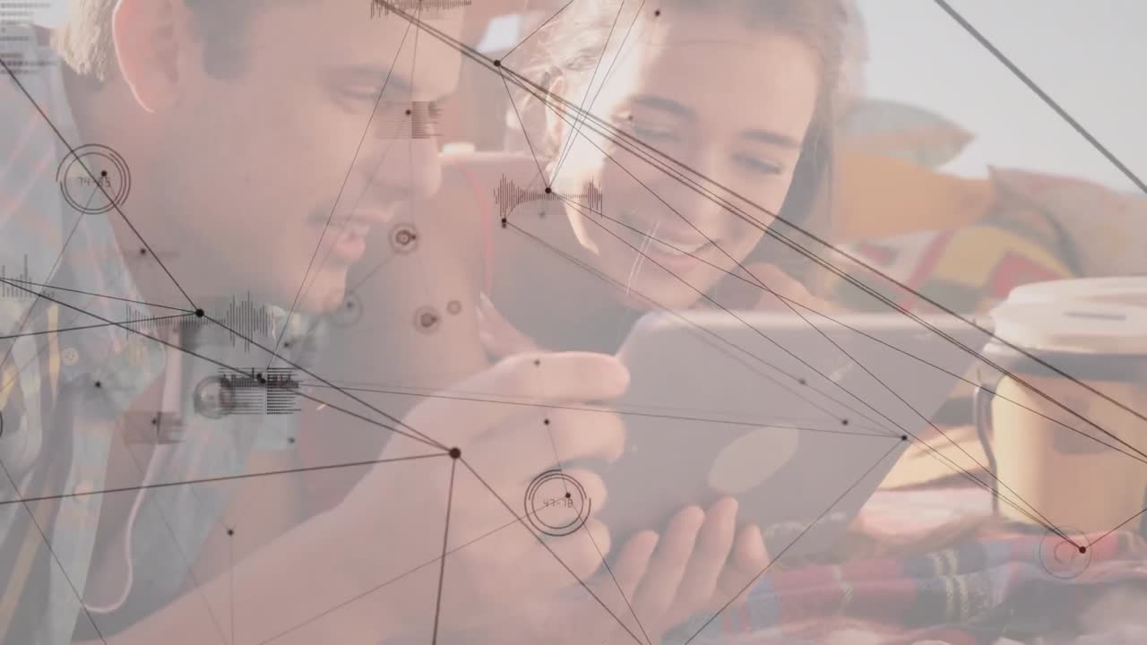 animación de redes de conexiones sobre una pareja caucásica usando una tableta