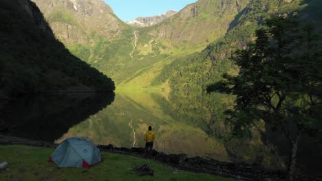 a drone shot of camping in naeroyfjord norway