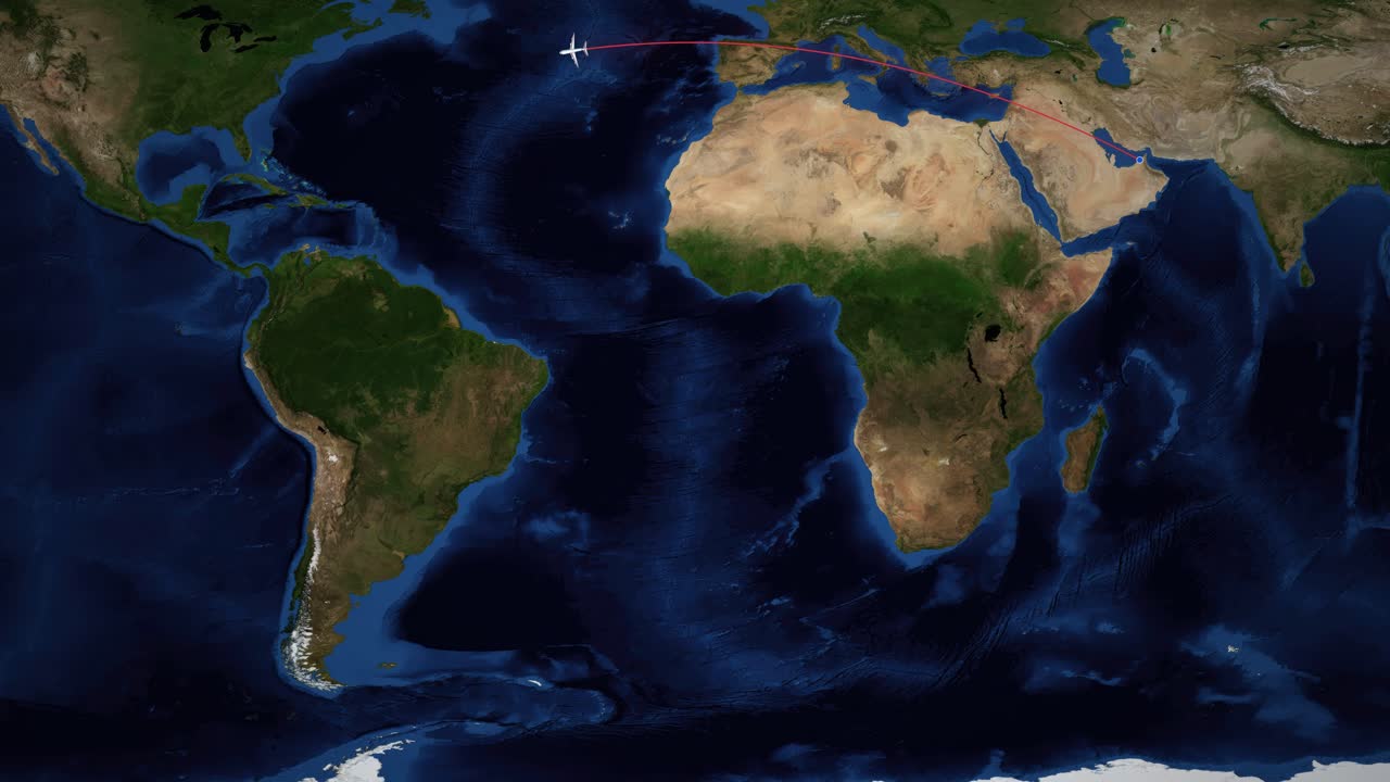 A digital world map tracks an airplane flying from Dubai to Miami across the Atlantic