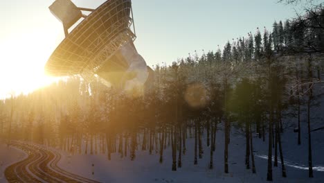 the observatory radio telescope in forest at sunset