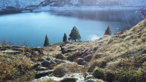 a blue clear water lake below the alps mountain in austria