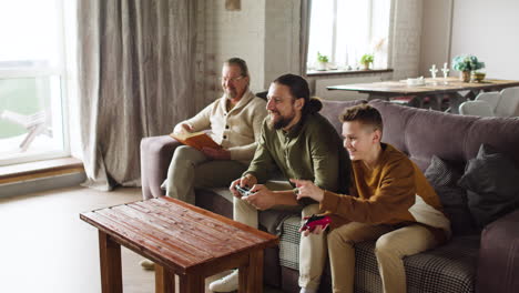 caucasian men and boy in the living room