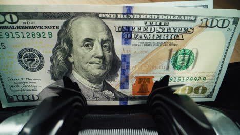 counting us hundred dollar bills