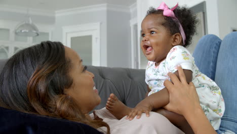 Slow-Motion-Shot-Of-Mother-Playing-With-Daughter-At-Home