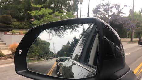 Driving-down-road-mirror-view