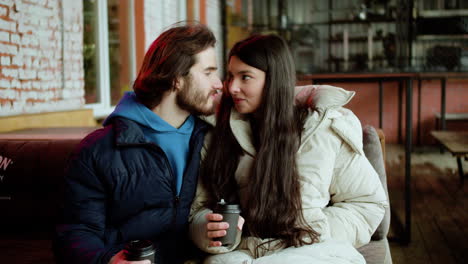 young man and woman drinking coffee