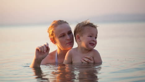 Mother-and-young-child-waving-goodbye