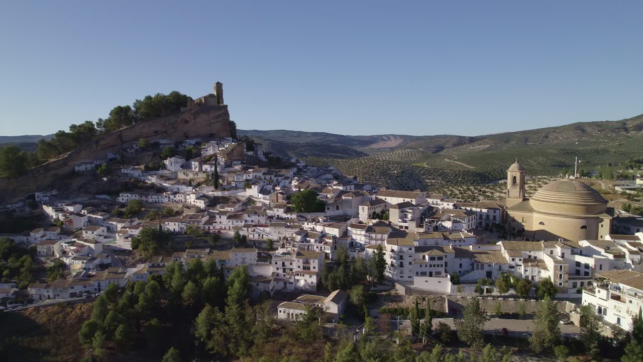 White villages, houses on mountain slopes. Spain. Montefrio. Pretty Spanish town, famous by National Geographic. Panoramic aerial view. Andalusia. Spain.