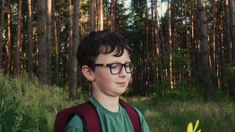 kid playing with toy in the forest