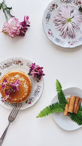 elegant breakfast arrangement with pancakes and flowers