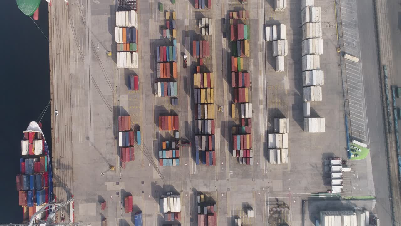 Cargo Containers and Moving Trucks in a Sea Port