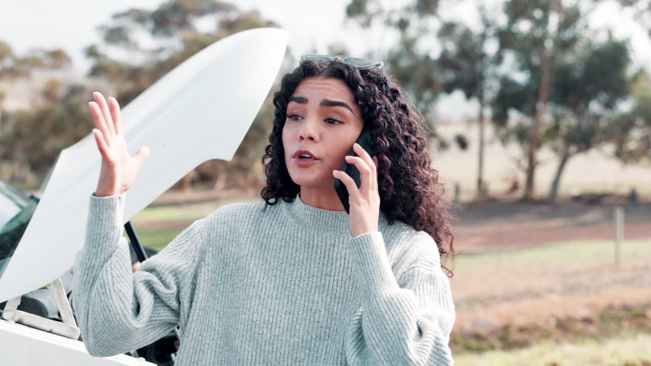 Woman with car trouble calling for help