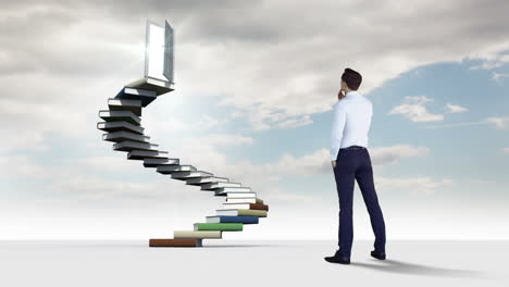 hombre de negocios mirando escalones hechos de libros