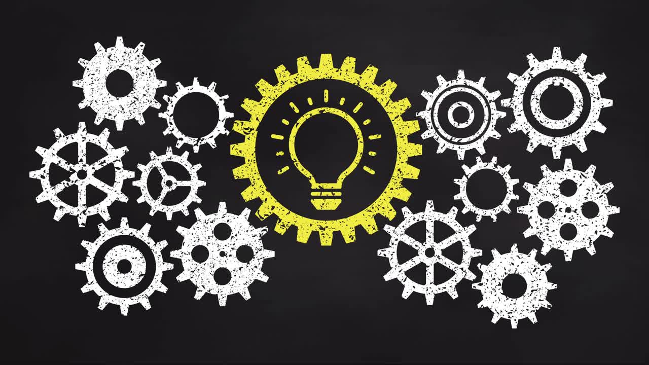 Business gear mechanism concept on blackboard. Yellow light bulb icon